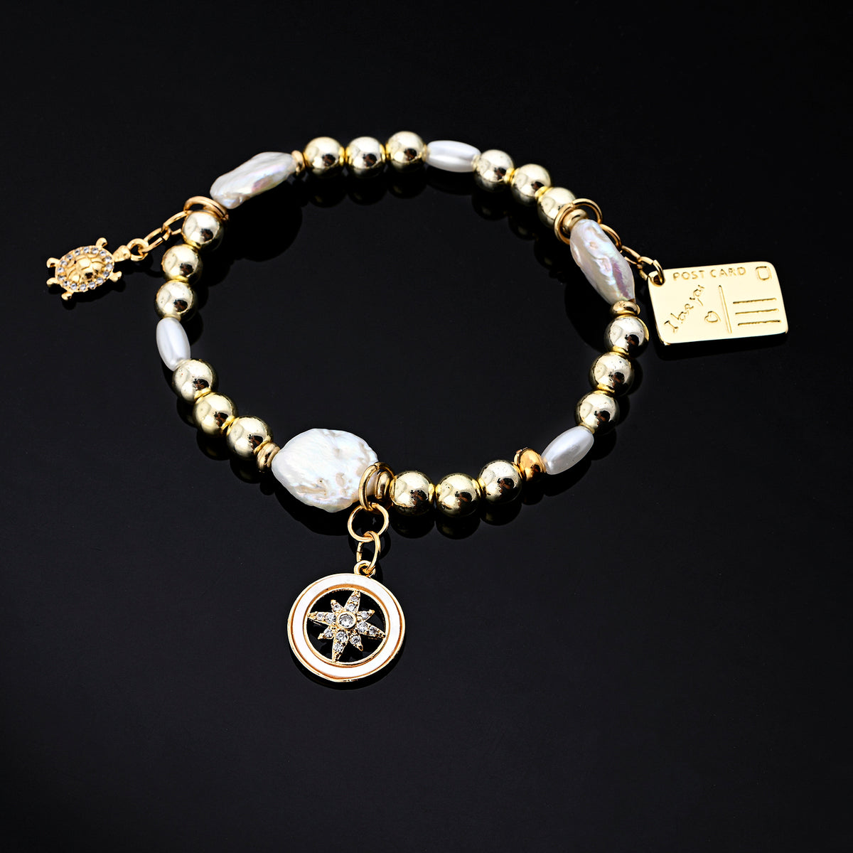 Isola Charm Bracelet (Turtle, Compass, Postcard)